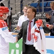 MINSK, BELARUS - MAY 15: Denmark's Morten Green #13 is presented with a jersey for playing his 257th game for Team Denmark during preliminary round action at the 2014 IIHF Ice Hockey World Championship. (Photo by Richard Wolowicz/HHOF-IIHF Images)